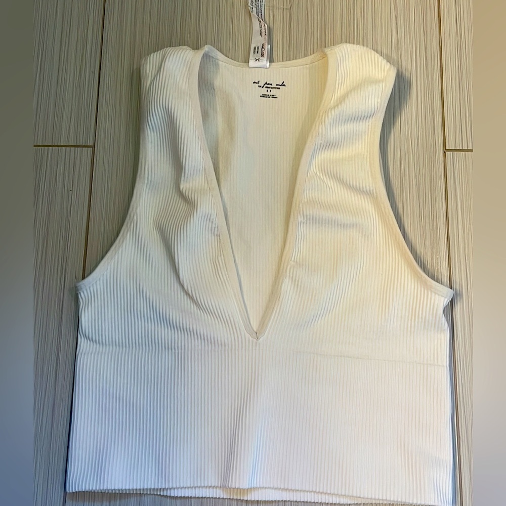 Urban outfitters “out from under” white top